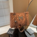 Quilted crossbody bag in lotus pink with a silver bow and metal chain strap - Pink