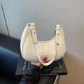 Chic ivory white dumpling crescent shoulder bag with pebbled leather and silver metal buckles - Off White