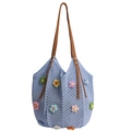 Light blue crochet tote bag with colorful floral patterns and brown fringe handles - Blue