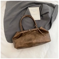 Close-up of vintage brown leather texture and gold buckle on a stylish tote bag - Small Brown