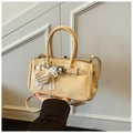 Beige textured handbag with pearl heart charm and crossbody strap for women - Yellow
