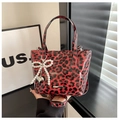 Red and black leopard print crossbody bag with pearl bow and heart charm details - With Pendant / Red