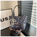 Blue leopard print crossbody bag featuring a pearl bow charm and adjustable strap - With Pendant / Blue