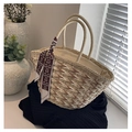 Detailed view of bicolor woven straw tote bag featuring a cute bear pattern silk scarf accessory - Khaki