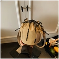 Detail of khaki nylon bucket bag showing drawstring closure and side mesh pocket - Khaki