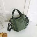 Minimalist olive green canvas tote bag with metal M logo and adjustable shoulder strap - Green