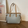 Blue-gray tote bag with brown leather trim and golden metal rings in variant style - Blue