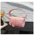 Detail of pink lychee textured faux leather bag with silver studs and zipper closure - One Size / Pink