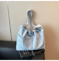 Detail of light blue checkered tote bag with drawstring closure and adjustable strap - One Size / Blue