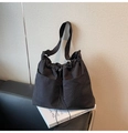 Detailed view of the black tote bag showing its waffle texture fabric and adjustable strap - One Size / Black