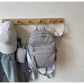 Detail of grey-purple lychee pattern backpack with geometric patterned shoulder straps - Gray