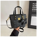 Black litchi grain crossbody bag with bear embossed pattern and bow charm detail - Black
