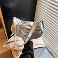 Silver metallic pleated crossbody bag featuring elegant bow details and thin strap - Silver