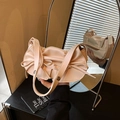 Pastel pink ballet-style pleated handbag with bow detail and metal ring strap buckle - Pink