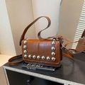 Dark brown faux leather crossbody bag with silver stud accents and adjustable strap - Brown
