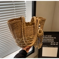 Detail of woven straw tote bag with wave pattern, twin handles and tassel charm - Khaki Small