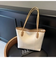 Minimalist beige tote bag with brown straps and embossed fashion text for daily commuting - Off White
