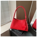 Detail of red woven shoulder bag with intricate knot and flat leather braiding texture - Red