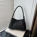 French style woven underarm bag in black with premium leather texture and round charm - Black