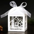 Detail of white laser-cut favor box with ribbon and Islamic architectural cutouts - White