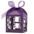 Macro shot of purple hollow-out gift box with laser-cut stars and matching silk ribbon bow - Dark Purple