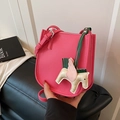 Rose pink lychee leather crossbody bucket bag with horse charm and adjustable strap - Rose Red