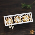 White laser-cut wedding favor box with gold lining and hollow ring pattern for chocolates - White