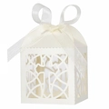 Detail of laser-cut cross pattern and ribbon bow on white hollow candy box for baptism - Ivory