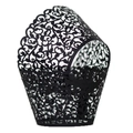 Macro detail of laser-cut cupcake wrapper featuring intricate black vine patterns - Black