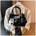 Glossy black patent leather bucket bag with cute white teddy bear charm and round handles - Black with Pendant