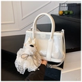 Cream bucket bag in transparent PVC with a plush puppy charm and crossbody strap - White with Pendant