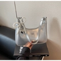 Detail of silver metallic handbag featuring pearl bow charm and heart metal pendant - Silver (With Pendant)