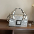 Silver snakeskin embossed handbag with bow detail and black square decorative buckle - Silver