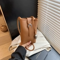 Brown lychee texture leather bucket phone bag with silver horseshoe buckle and heart charm - Brown