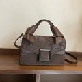 Brown snakeskin embossed square bag with hand strap and metallic buckle accent - Brown