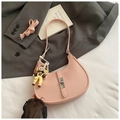 Pink crescent shoulder bag in lychee leather with silver lock and cartoon charm - Pink with Pendant