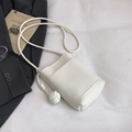 White lychee pattern leather mini crossbody bucket bag with knot tassel detail - White