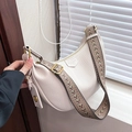 Creamy white dumpling crossbody bag in lychee texture with a colorful wide shoulder strap - Off White