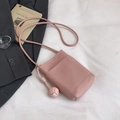 Pink lychee grain leather mini crossbody phone bag with knot detail on white fabric - Pink