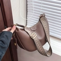Brown litchi leather hobo bag with a geometric woven wide strap and golden hardware - Brown