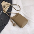 Minimalist khaki bucket crossbody bag with pebble texture and woven knot charm - Khaki
