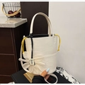 White lychee pattern bucket bag featuring a large chiffon flower charm and yellow drawstring - Coconut Milk White