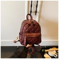 Mini burgundy quilted backpack with gold hardware and classic rhombus pattern texture - Fuschia
