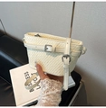 Chic beige crossbody bag with woven texture, adjustable strap and silver metal buckle - White