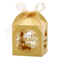 Close-up of laser-cut Happy Birthday favor box with golden shimmer and organza ribbon - Gold