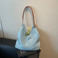 Light blue crochet tote bag with hollow knit pattern and brown leather shoulder strap - Blue