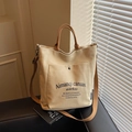Beigefarbene Canvas-Einkaufstasche mit großer Vordertasche und braunem Schultergurt - Khaki