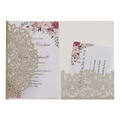 Detailed view of champagne gold laser-cut wedding invitation set with floral inserts - Light Gold Glitter