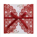Detail of red glitter laser-cut wedding invitation with satin bow and floral inner card - Glitter Red