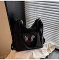 Detail of cute puppy patch with red stripes on a black nylon backpack for women - Black